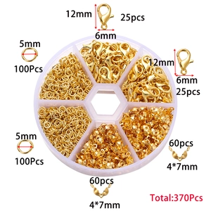 Top view of 370pcs golden lobster clasps and jump rings set in a clear plastic box
