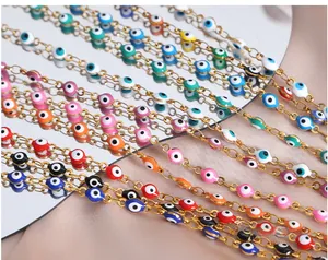 Macro shot of colorful enamel evil eye pendants on gold-plated stainless steel chains