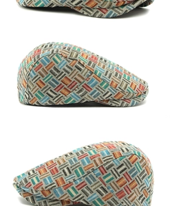 Detailed view of vintage multi-color woven newsboy cap with geometric jacquard texture