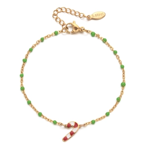 Detail of gold Christmas bracelet with green beads and a red candy cane pendant