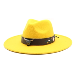 Detail of yellow wool fedora featuring bronze bull head buckle and floral embroidery