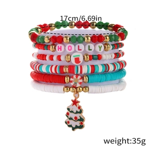 Detail view of multi-layer Christmas bead bracelet with HOLLY letters and tree charm