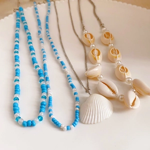Bohemian style 4-piece multilayer necklace set with natural shells and beaded strands