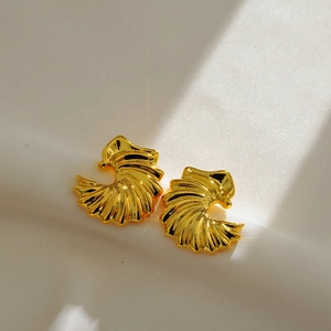 Retro pleated fan-shaped gold-plated copper earrings displayed on white fabric