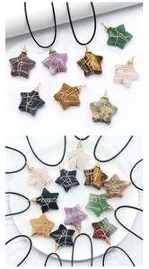 Detailed close-up of wire-wrapped 30mm star-shaped natural crystal pendants on black cords