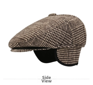 Detailed view of brown houndstooth flat cap featuring foldable ear flaps for winter