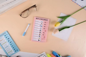 Detailed view of pink habit tracker board with sliding buttons and daily task checklist