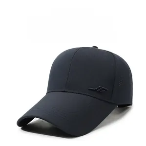 Detail of laser-cut ventilation holes and striped metal logo on a breathable baseball cap