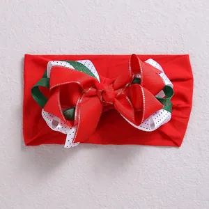 Elastic nylon headband for girls featuring a triple-layered red polka dot ribbon bow