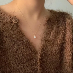 Elegant 925 sterling silver heart pendant necklace with zircon on a gold chain