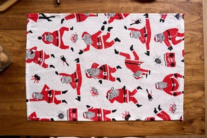 Detail of Christmas napkin featuring Santa Claus and disco ball print on cotton linen