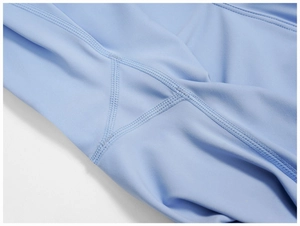 Detailed close-up of reinforced triple stitching and gusset on lilac yoga pants