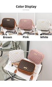 Detailed close-up of three geometric printed camera bags with wide lettered shoulder straps