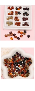 Macro shot of assorted coffee bean acrylic beads with gold foil stripes for DIY jewelry