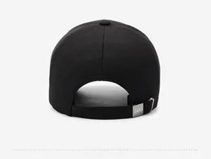 Detail view of the black baseball cap showing the adjustable strap and silver metal buckle