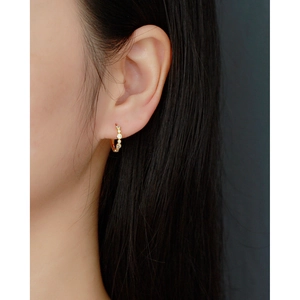 Elegant gold S925 sterling silver hoop earrings with clear sparkling zircon stones on model