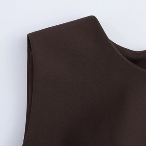 Detail of the deep coffee knit fabric and shoulder stitching on a sleeveless dress