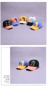 Detail of color-block children's baseball caps with cartoon dinosaur embroidery