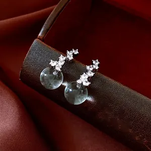French style silver earrings with zircon pavé studs and gray cat-eye round pendants