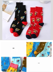 Close-up of crew socks featuring tiger embroidery and colorful graphic patterns
