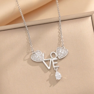 Silver LOVE necklace with rhinestone hearts and teardrop crystal pendant in a gift box