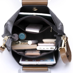 Large capacity black PU leather tote bag showing spacious interior with multiple compartments