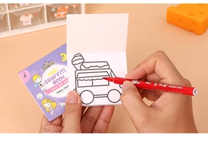 Close-up of fairy tale themed mini graffiti book with brush pen and ice cream illustration