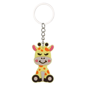 Detailed view of yellow giraffe PVC keychain with orange spots and silver metal ring