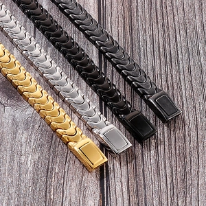 Detail of dragon bone link bracelets in gold, silver, black, and gunmetal stainless steel
