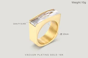 Close-up of 8mm wide 18K gold plated stainless steel ring with rectangular glass stone