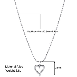 Detail view of silver heart pendant necklace with dimensions and material specifications