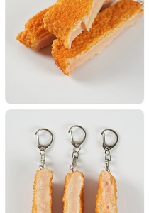 Macro view of realistic fried chicken keychain with golden crispy texture and metal ring