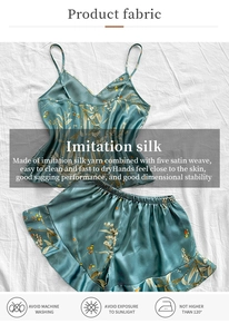 Detailed view of blue floral satin pajamas set with camisole top and ruffled shorts