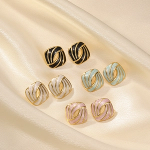 French vintage enamel square earrings in four colors on elegant beige silk fabric
