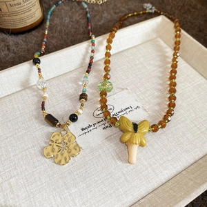 Artistic resin crystal beaded necklaces with gold flower and yellow butterfly pendants
