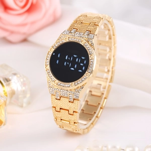 Detail of luxury gold steel LED watch with rhinestone bezel and black digital display