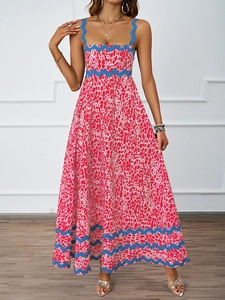 Detail of blue scalloped trim on a red and white printed summer maxi dress for women