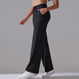 Close-up of wide-leg yoga pants featuring elastic high waist with adjustable drawstring