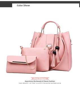 Three-piece pink tote bag set including shoulder bag and chain wallet with tassel detail