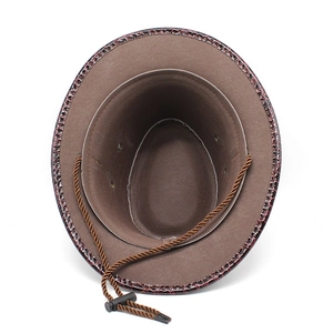 Detail of coffee brown western cowboy hat with crocodile texture brim and windproof rope