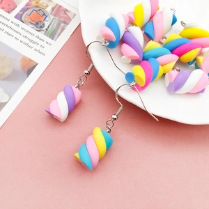 Detail of colorful resin marshmallow pendants with S925 silver hooks on a white plate