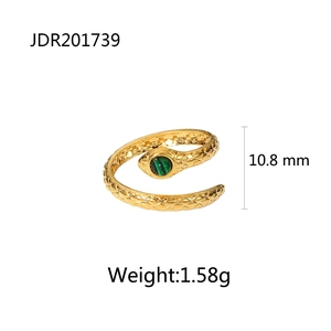 Detailed view of golden snake ring with green stone inlay and fine diamond textures