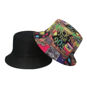 Detail of retro graffiti bucket hats with 90s hip hop patterns and plain black canvas design