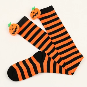 Detail view of orange and black striped over-knee socks with 3D pumpkin decoration