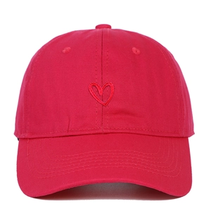 Close-up of red embroidered heart pattern on premium cotton canvas baseball cap