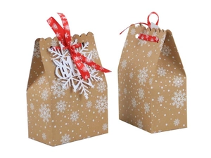 Christmas kraft paper gift bag with white snowflakes and red ribbon bow decoration