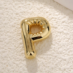 Detailed view of a 3D balloon letter P pendant with a polished gold-plated mirror finish