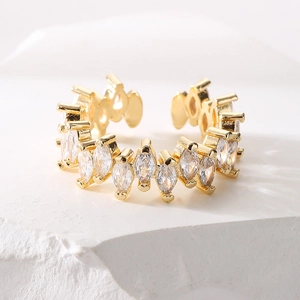 Luxury gold plated open ring with marquise cut cubic zirconia stones on textured stone
