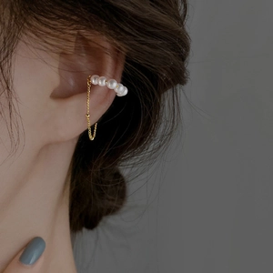 Gold-plated pearl ear cuff with tassel chain showing on ear for non-pierced women