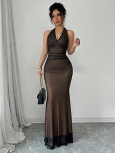 Close-up of ruched mesh fabric texture and bodycon silhouette on a brown maxi dress